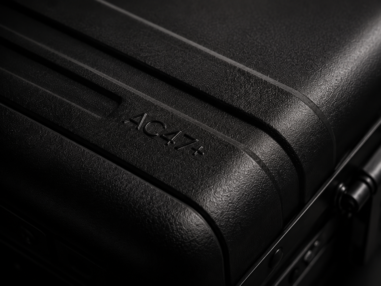 Close view of a molded black shell corner.